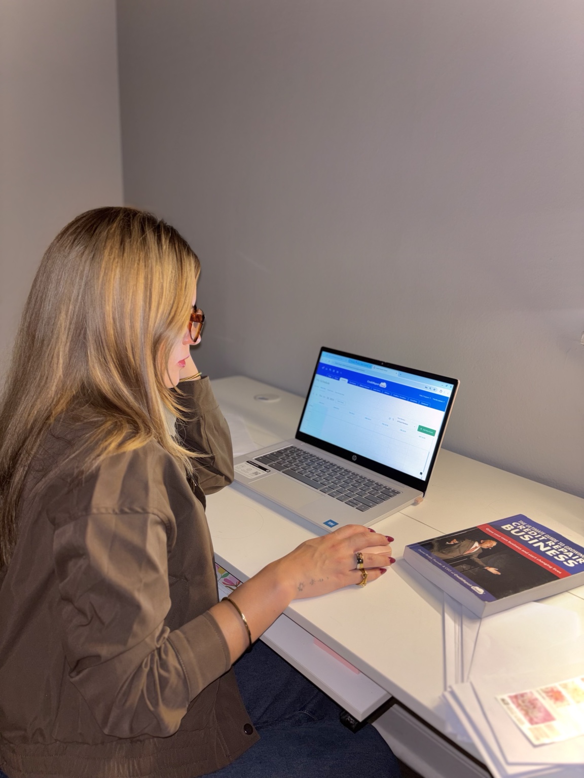 Fiorella working at her desk, behind the scenes